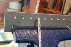 Fine silver double loop-in-loop going through the drawplate to even it out