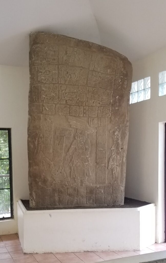 Carved stela at Nim Li Punit